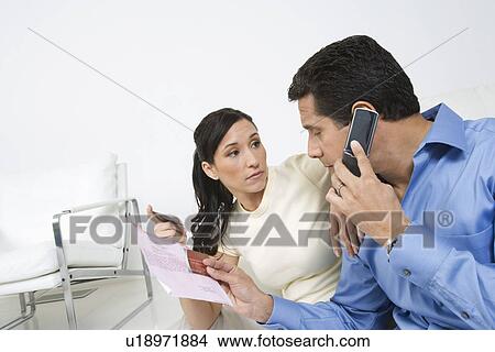 Picture - Couple Holding Credit Cards. Fotosearch