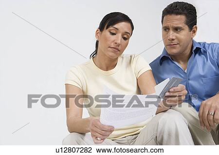 Couple Looking at Credit Card Bill View Large Photo Image Stock Image - Couple Looking at Credit Card Bill. Fotosearch