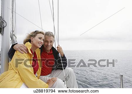 Picture - Couple on yacht. Fotosearch