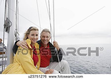 Stock Photograph - Couple on yacht, portrait. Fotosearch