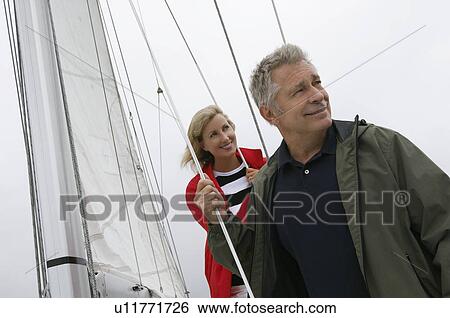 Stock Photograph - Couple on yacht. Fotosearch