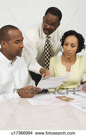 Picture - Couple Seeing Accountant. Fotosearch