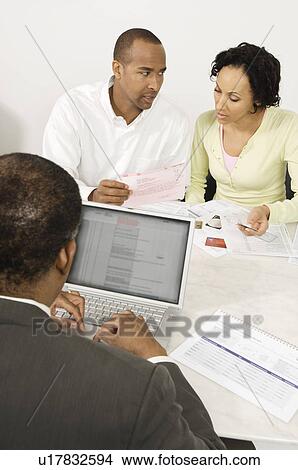 Picture - Couple Seeing Accountant. Fotosearch