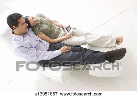 Couple Watching Portable TV View Large Photo Image Stock Photo - Couple Watching Portable TV. Fotosearch