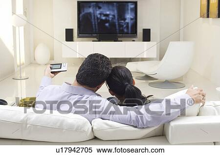 Stock Photography - Couple Watching TV. Fotosearch