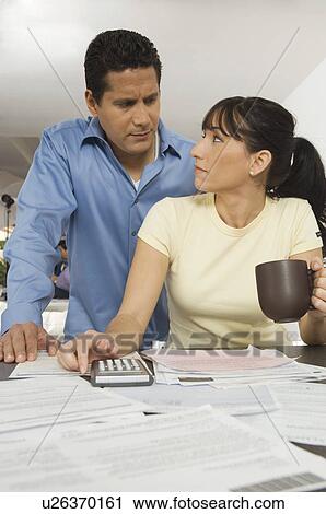 Couple Working on Bills View Large Photo Image Stock Image - Couple Working on Bills. Fotosearch