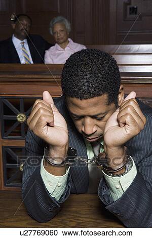 Criminal sitting in court View Large Photo Image Stock Image - Criminal sitting in court. Fotosearch
