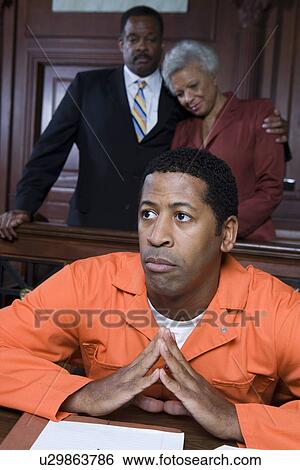 Criminal sitting in court View Large Photo Image Stock Photograph - Criminal sitting in court. Fotosearch