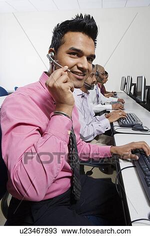 Stock Image - Customer Service Rep in Call Center. Fotosearch