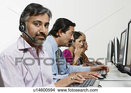 Picture - Customer Service Reps in Call Center. Fotosearch