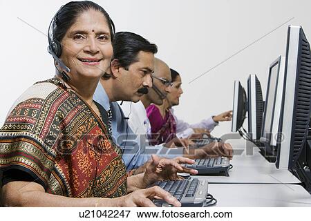 Stock Photo - Customer Service Reps in Call Center. Fotosearch