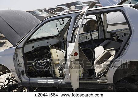 Damaged car in junkyard View Large Photo Image Picture - Damaged car in junkyard. Fotosearch