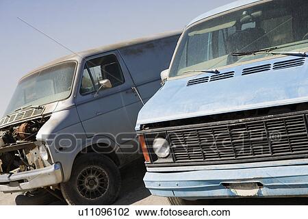 Stock Image - Damaged cars in junkyard. Fotosearch