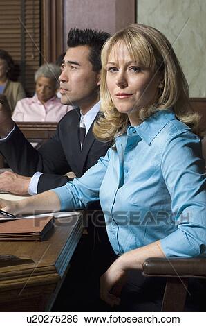 Defense lawyer with client in court View Large Photo Image Stock Photograph - Defense lawyer with client in court. Fotosearch