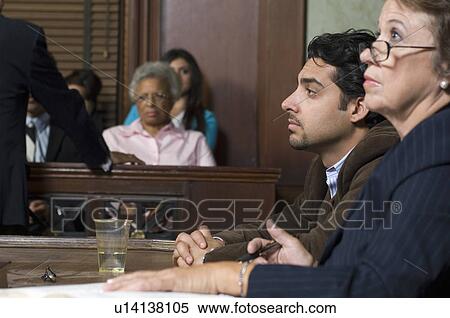 Stock Photography - Defense lawyer with client in court. Fotosearch