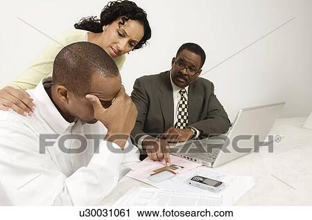 Stock Image - Disappointing Meeting with Accountant. Fotosearch