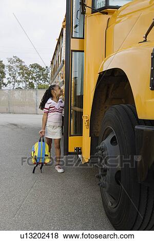 Elementary Student Getting onto School Bus View Large Photo Image Stock Photo - Elementary Student Getting onto School Bus. Fotosearch