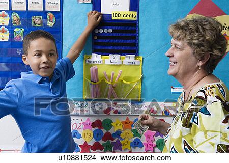 Elementary Student Learning to Count Money View Large Photo Image Picture - Elementary Student Learning to Count Money. Fotosearch