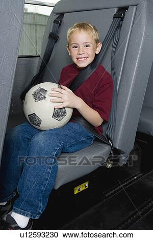 Stock Image - Elementary Student on School Bus. Fotosearch