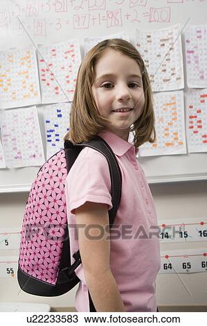Stock Image - Elementary Student Wearing Backpack. Fotosearch
