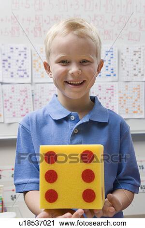 Stock Image - Elementary Student with Large Die. Fotosearch