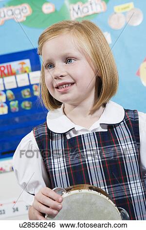 Elementary Student with Tambourine View Large Photo Image Stock Photograph - Elementary Student with Tambourine. Fotosearch