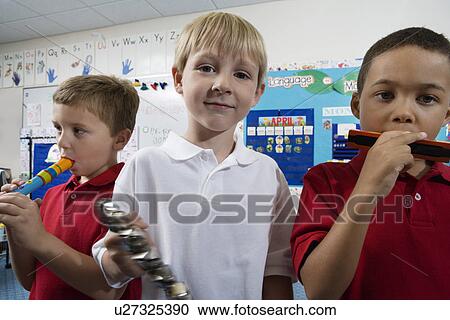 Stock Image - Elementary Students in Music Class. Fotosearch