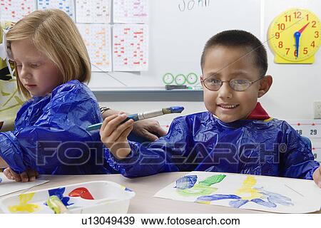 Stock Photo - Elementary Students Painting. Fotosearch