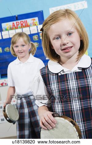 Stock Image - Elementary Students with Tambourines. Fotosearch