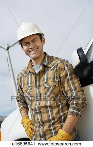 Engineer by van at wind farm, portrait View Large Photo Image Stock Image - Engineer by van at wind farm, portrait. Fotosearch