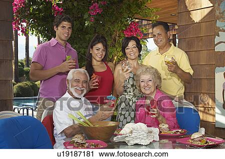Family with drinks on porch View Large Photo Image Stock Image - Family with drinks on porch. Fotosearch