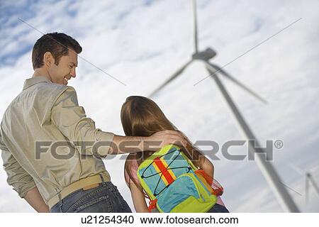 Father embracing daughter (5-6) at wind farm View Large Photo Image Stock Image - Father embracing daughter (5-6) at wind farm. Fotosearch