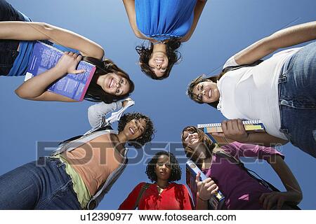 Female college students standing in circle, view from below View Large Photo Image Stock Photo - Female college students standing in circle, view from below. Fotosearch