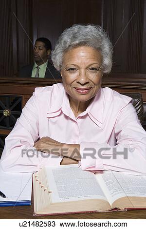 Stock Image - Female solicitor working in court, portrait. Fotosearch
