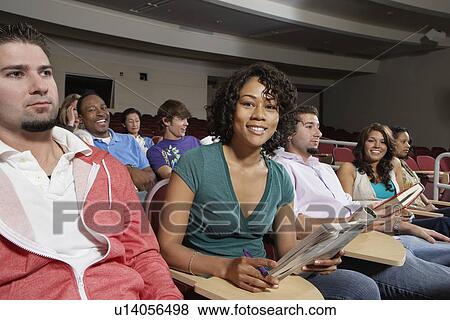 Stock Photo - Female student sitting in class, portrait. Fotosearch