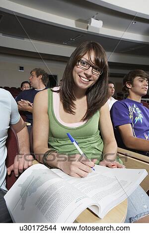 Female student working in class, portrait View Large Photo Image Picture - Female student working in class, portrait. Fotosearch
