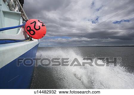 Stock Image - Fishing boat on lake. Fotosearch