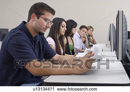 Five students working in computer classroom View Large Photo Image Stock Image - Five students working in computer classroom. Fotosearch