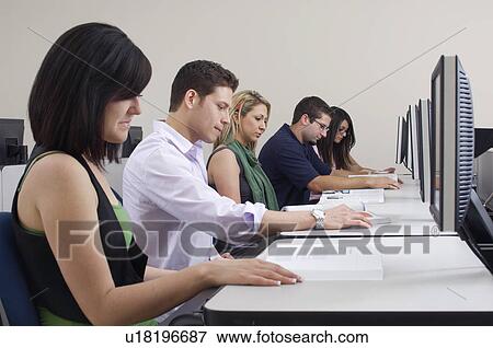 Five students working in computer classroom View Large Photo Image Stock Photo - Five students working in computer classroom. Fotosearch