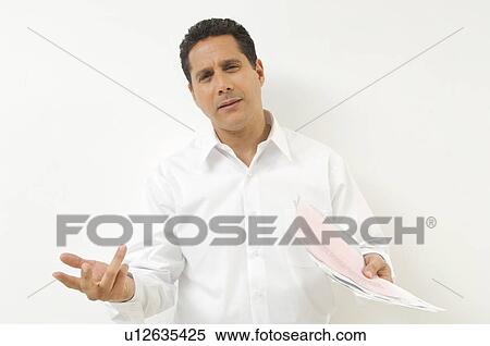 Stock Photography - Frustrated Man with Documents. Fotosearch