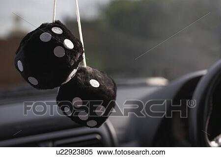 Furry dice hanging in car View Large Photo Image Stock Photography - Furry dice hanging in car. Fotosearch