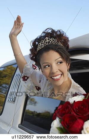 Girl (13-15) waving from car window at Quinceanera View Large Photo Image Stock Photo - Girl (13-15) waving from car window at Quinceanera. Fotosearch