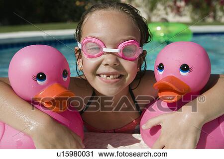 Girl at Pool Side Holding Pink Rubber Ducks View Large Photo Image Stock Image - Girl at Pool Side Holding Pink Rubber Ducks. Fotosearch