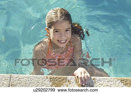 Girl in swimming pool, portrait View Large Photo Image Stock Photo - Girl in swimming pool, portrait. Fotosearch