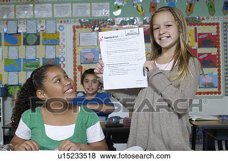Stock Photo - Girl presenting her test result. Fotosearch