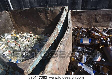 Stock Image - Glass bottles in bins. Fotosearch