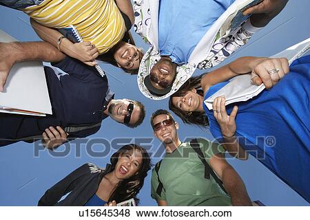 Stock Photo - Group of college students in circle, view from below. Fotosearch