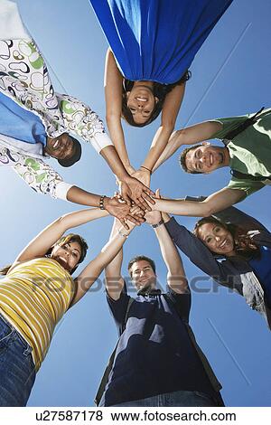 Group of college students in circle, view from below View Large Photo Image Stock Photo - Group of college students in circle, view from below. Fotosearch