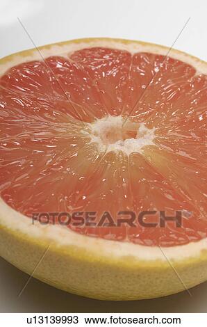 Halved grapefruit, close-up View Large Photo Image Stock Image - Halved grapefruit, close-up. Fotosearch