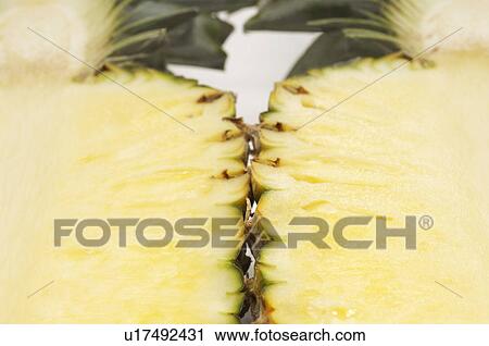 Halved pineapple, close-up View Large Photo Image Stock Image - Halved pineapple, close-up. Fotosearch